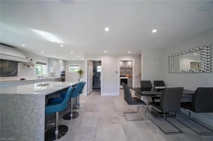 Dining room with recessed lighting, visible vents, and baseboards