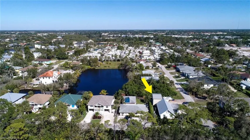 Drone / aerial view featuring a water view and a residential view