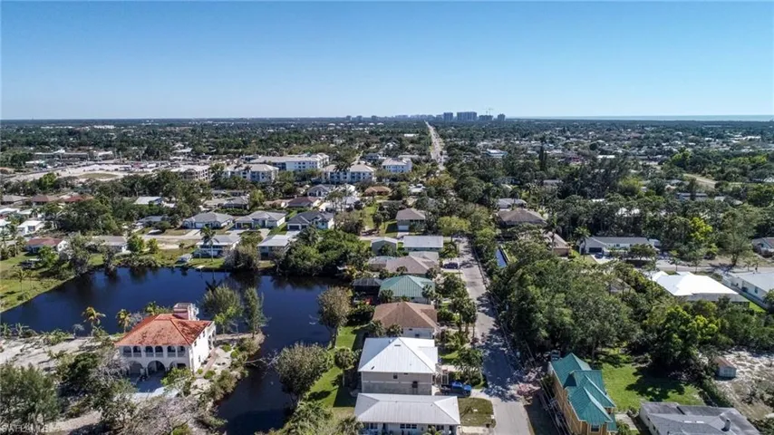 Drone / aerial view featuring a residential view and a water view