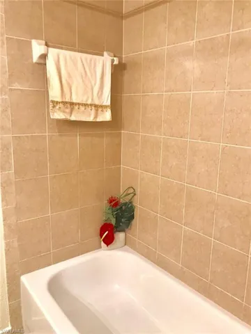 Full bathroom with a garden tub