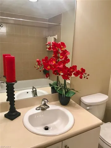 Bathroom featuring vanity and shower / bathtub combination