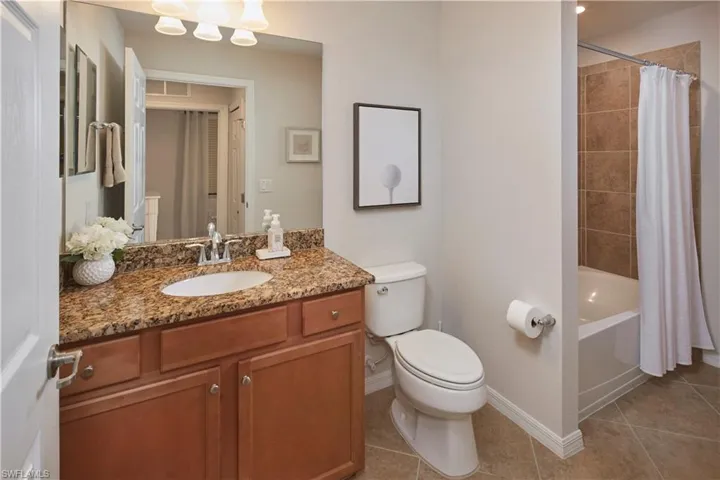Guest bathroom located in hallway, just off second bedroom.