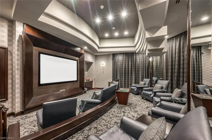 Large screen theatre with comfy seating.