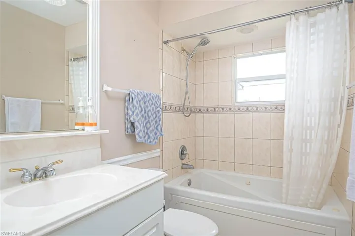 Full bathroom featuring jacuzzi tub