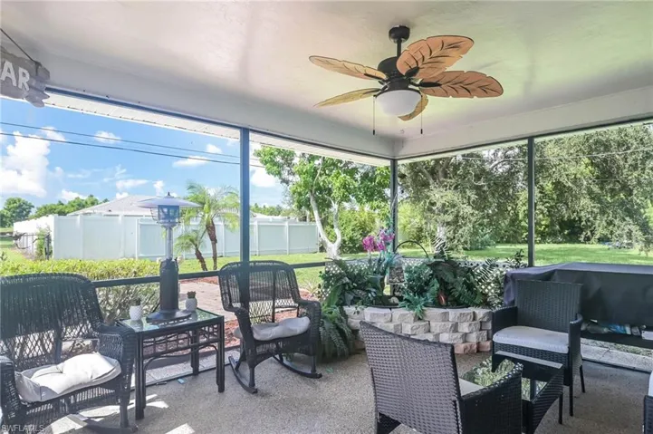 Sunroom / solarium with ceiling fan and plenty of natural light
