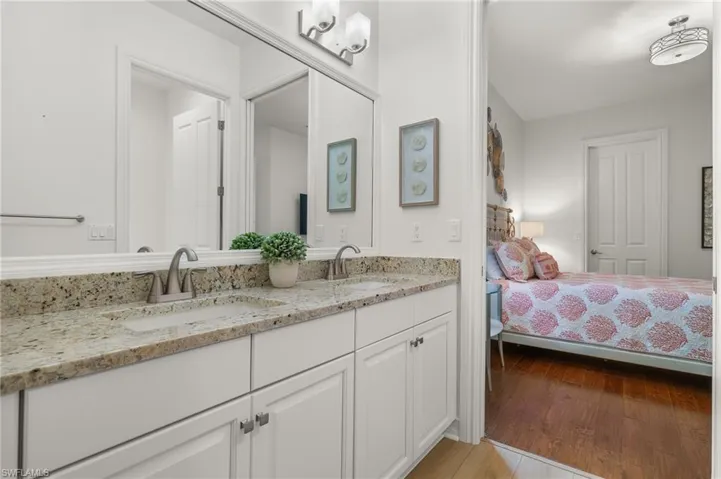 Bathroom with vanity and hardwood / wood-style floors