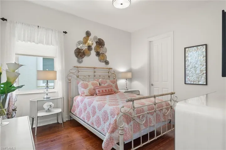 Bedroom featuring dark hardwood / wood-style floors