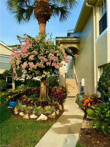 Entrance to property with stucco siding