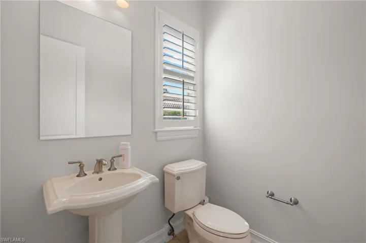 Bathroom featuring sink and toilet