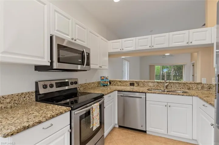 Kitchen has granite and stainless
