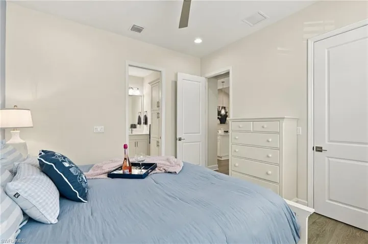 Recessed lighting, ceiling fan, hard surface flooring, light neutral wall color, and white paneled doors