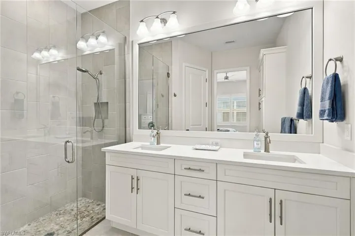 Dual vanity with undermount sinks and white countertops