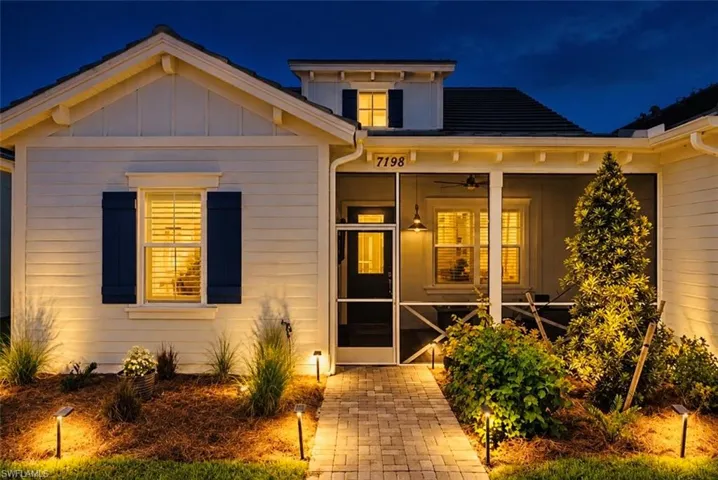 Exterior featuring horizontal siding and blue louvered shutters