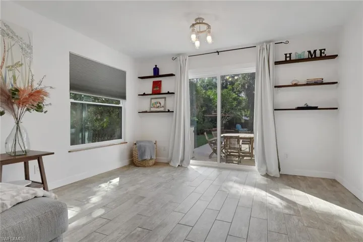 Dining Room off the living room with access to the patio/pool area. Also ideal for entertaining!