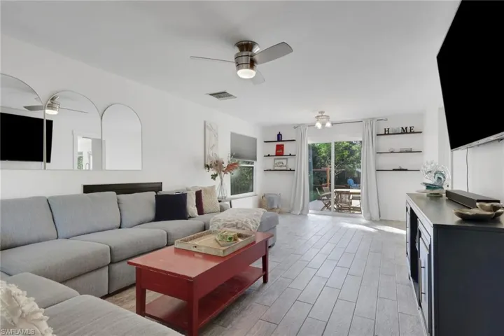 Spacious living and dining room with access to the outdoor pool/patio area