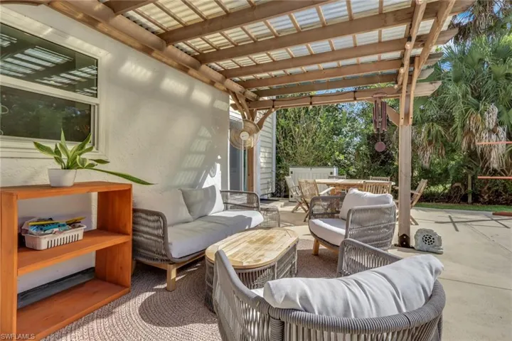 Pergola area giving you shaded seating area and a perfect view of the pool and backyard