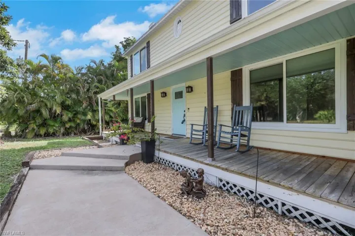This two-story home greets you with a large wood deck along the front of the home. Sit and enjoy your morning coffee or relax and enjoy the sunset with your favorite beverage