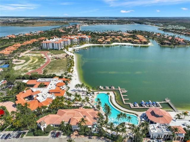 Amenity Complex. Partial view of 750 acres of fresh water lakes for fishing, and water sports. Includes miles of white sand beaches, formal beach club complex with full European style spa, fitness center, marina and Blue Water Grill with open air beachfront lunch and dinner dining and 210 foot resort pool