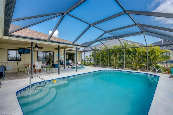 Pool featuring a lanai, a patio area, and ceiling fan