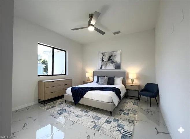 Bedroom with light marble finish floors and ceiling fan