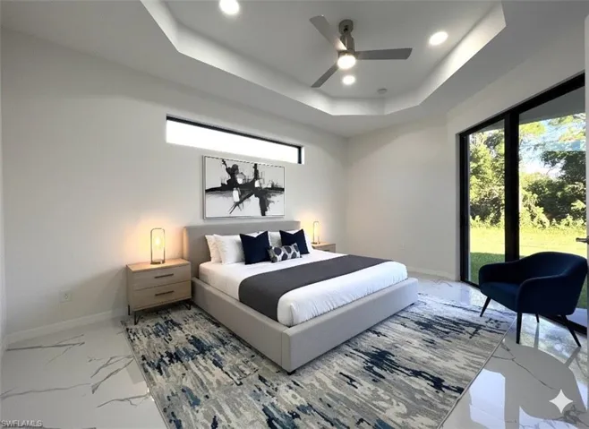 Bedroom with a tray ceiling, a ceiling fan, access to outside, marble look tiles, and recessed lighting