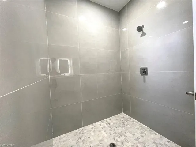 Full bathroom with a tile shower
