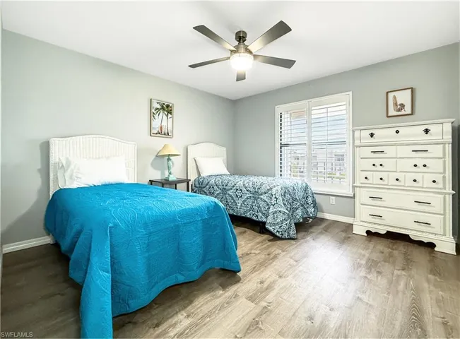 Guest bedroom with two twin beds and plenty of storage space.
