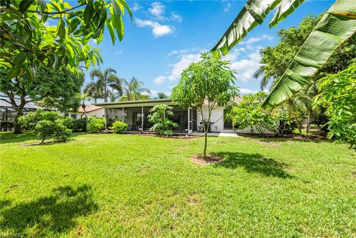 View of HUGE yard featuring a sunroom and enough space for a large pool+pool cage