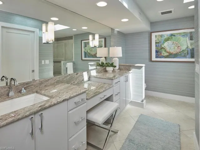 Full bathroom with vanity, recessed lighting, and light tile patterned flooring