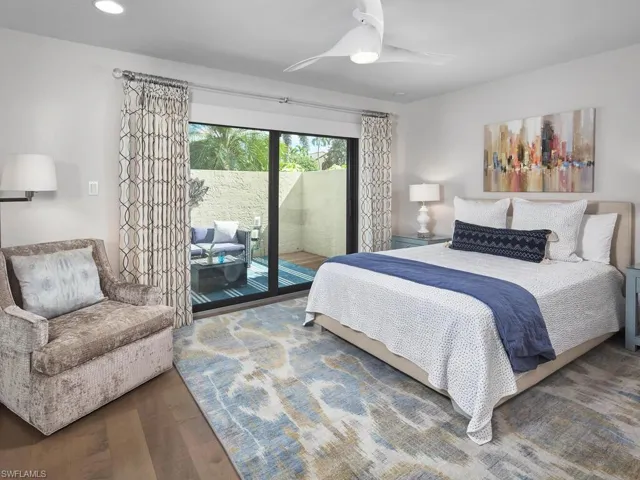 Bedroom featuring access to exterior, wood finished floors, ceiling fan, and recessed lighting