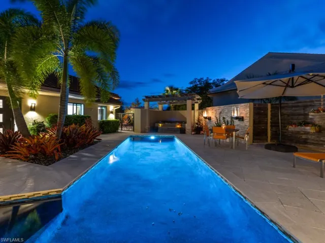 View of pool featuring a patio area and a pergola
