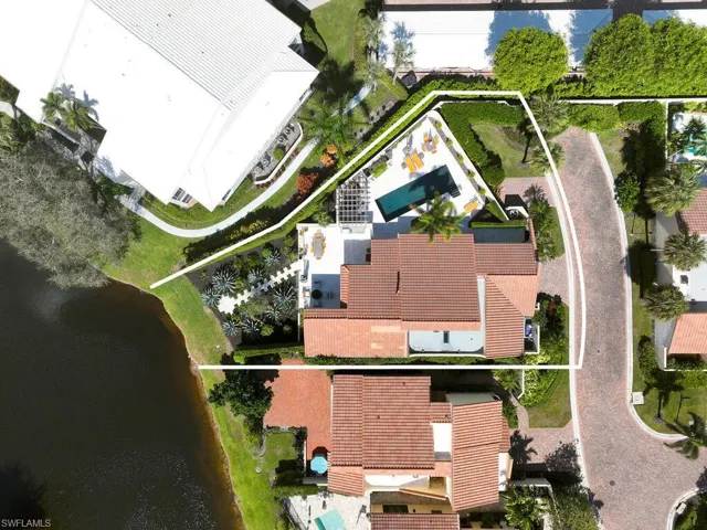 Aerial view of property and surrounding area with property parcel outlined