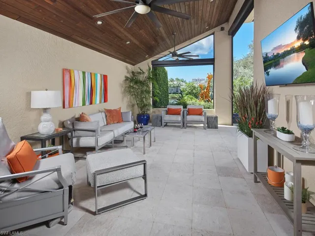 View of patio featuring an outdoor living space and ceiling fan