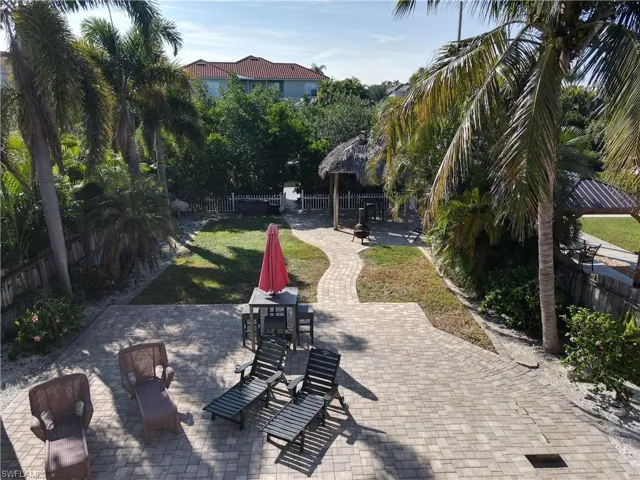 Fenced backyard featuring a patio