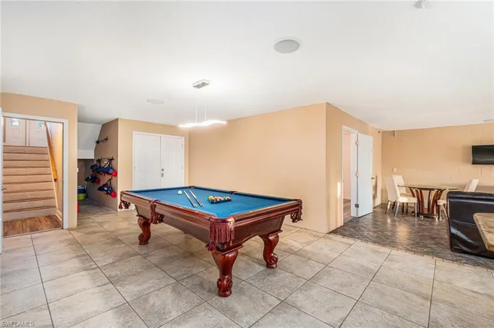 Family/ Recreation room with billiards and light tile patterned flooring
