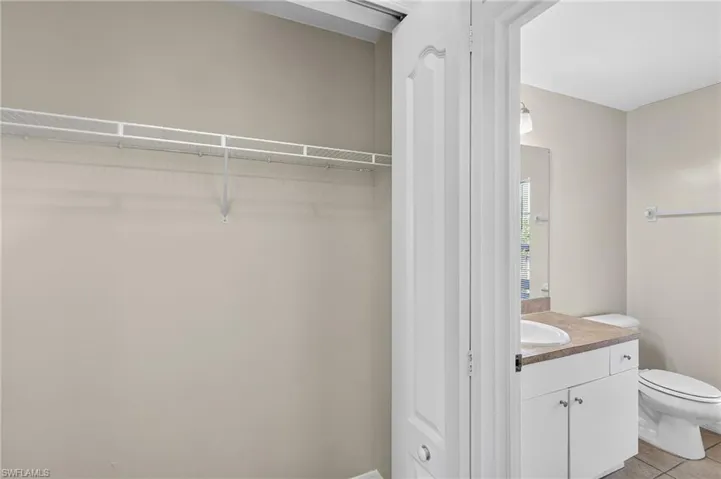Bathroom featuring vanity and light tile patterned floors