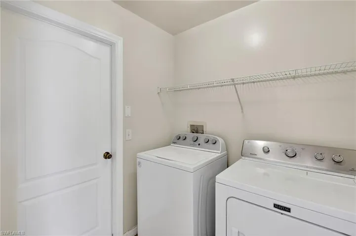 Laundry room featuring independent washer and dryer