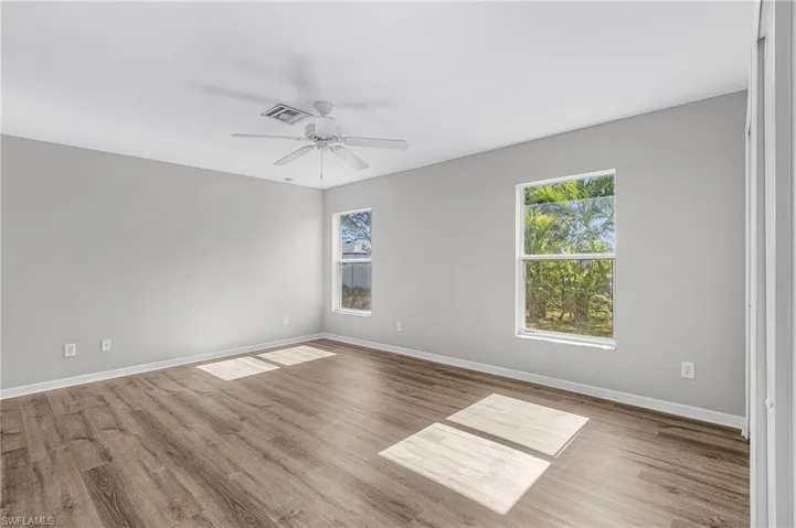 Unfurnished room featuring light wood-style floors and a ceiling fan