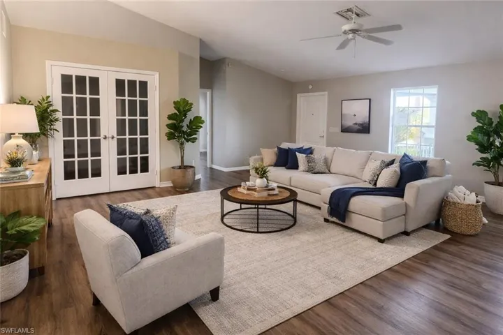 Living room featuring wood finished floors, french doors, and ceiling fan