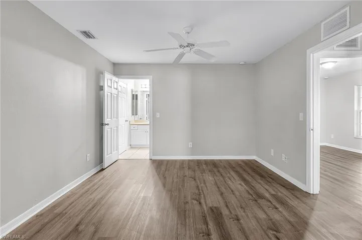 Spare room featuring wood finished floors and ceiling fan