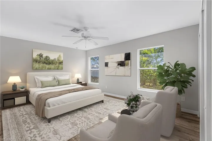 Bedroom featuring a ceiling fan and wood finished floors