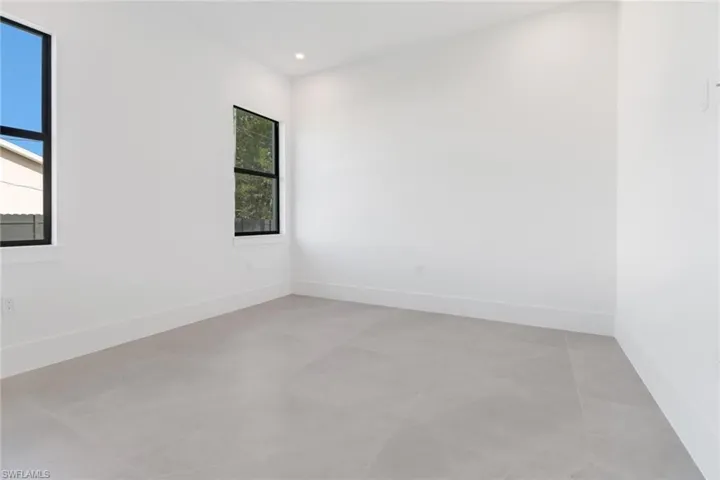 Tiled empty room with a wealth of natural light