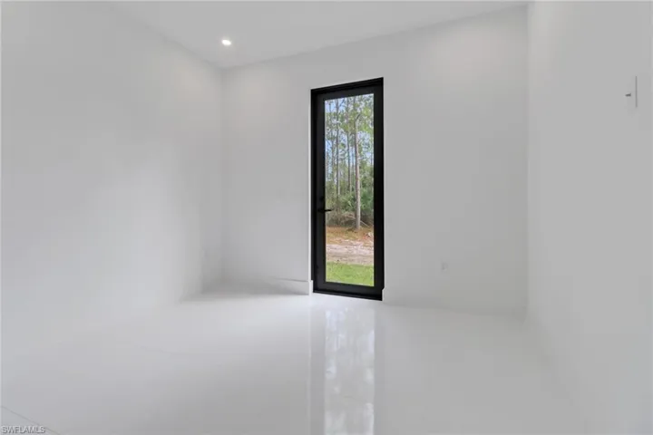 Spare room with tile patterned flooring