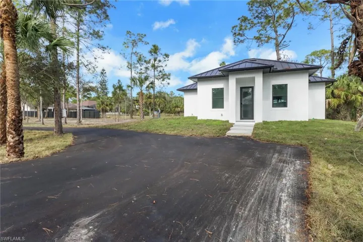 View of front of property with a front lawn