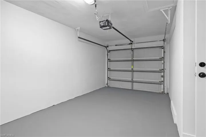 Garage featuring a garage door opener
