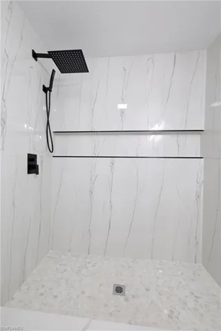 Bathroom featuring tiled shower