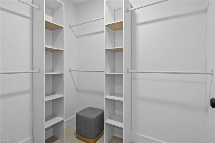 Walk in closet featuring wood-type flooring