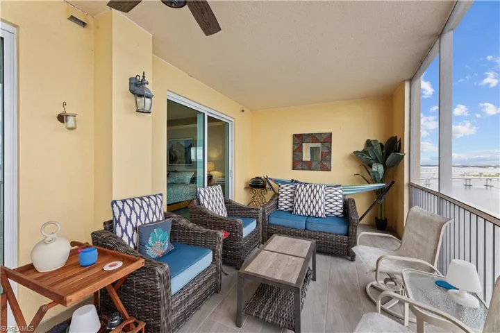 Sunroom / solarium featuring ceiling fan