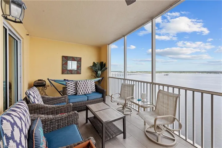 Sunroom / solarium with a water view