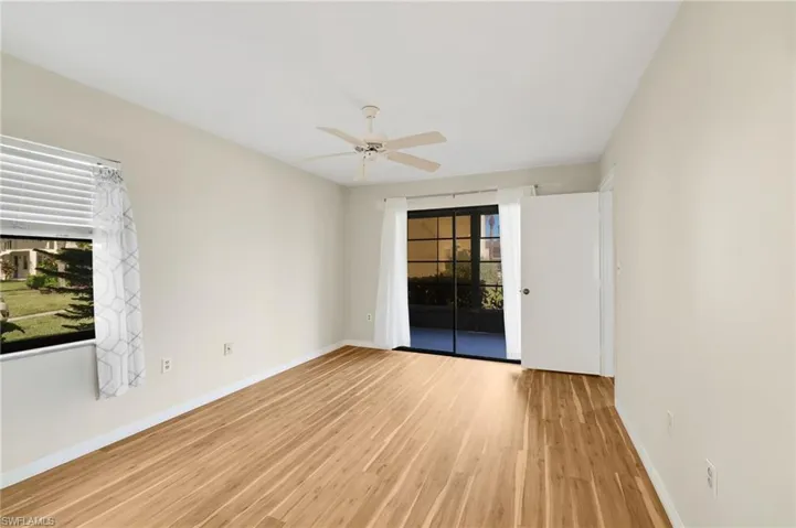 Spare room with light wood-style flooring and ceiling fan